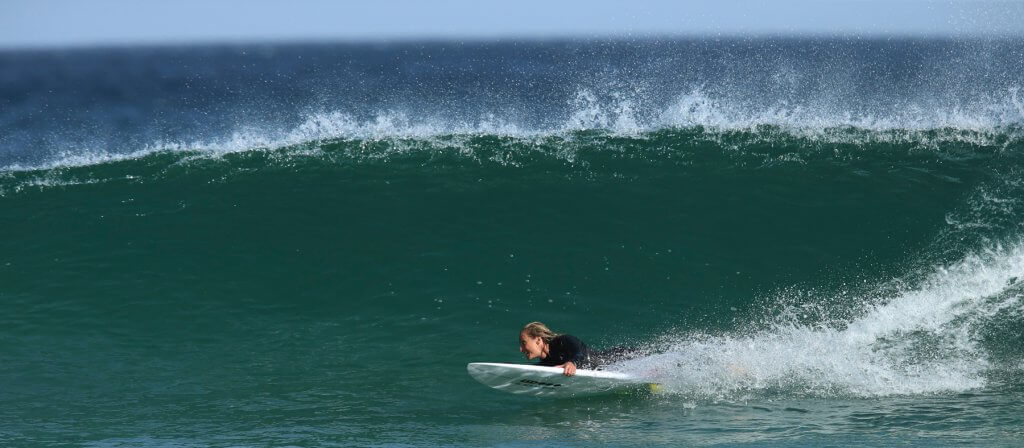 Sam Bloom surfing
