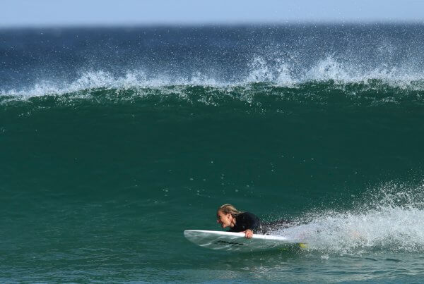 Sam Bloom surfing